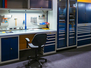 Car workshop. Vehicle Maintenance.Work room in a car service. Workshop of the manager of a car...