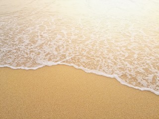 white ocean waves on sandy beach