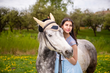 Blond and a Horse Outdoors