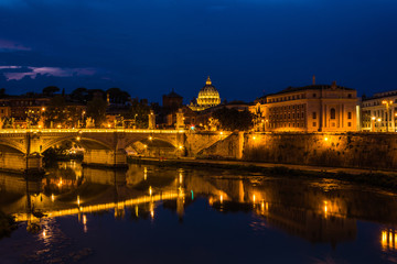 Fototapeta na wymiar View over river tiber to Saint peters basilica in rome by night