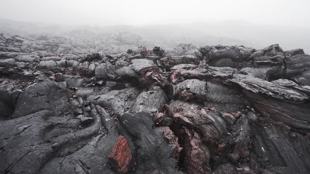 The steam coming out of the cracks of volcanic lava layer. Tolbachik volcano, Kamchatka, Russia