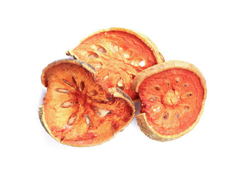 Dry bael fruit ( Aegle marmelos) slice isolated on white background with clipping path..