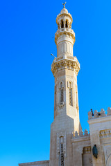 Fototapeta na wymiar Minaret of central mosque in El Dahar district of the Hurghada city, Egypt