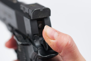 Gun in hand isolated onwhite background.