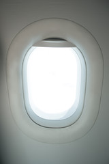 Airplane window with white blank space for travel images. 