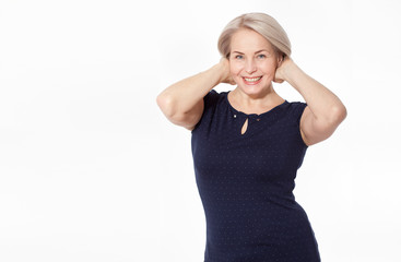 Happy woman emotionally posing in studio. Middle aged woman on white background