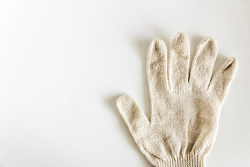 one work new cotton glove on a white background lies with spread out fingers