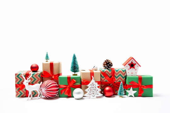 Row of Christmas presents and ornaments isolated on white