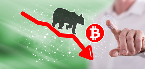 Man touching a bitcoin bearish trend concept