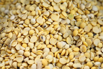 Soybean, dry yet untreated soybean, in the farmer's hangar Soybean, closeup. Open soy pods on the background of dry beans.