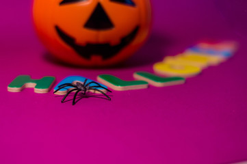 Halloween message made with letters between a pumpkin.