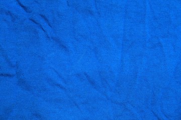 Abstract wrincled blue textile background or texture