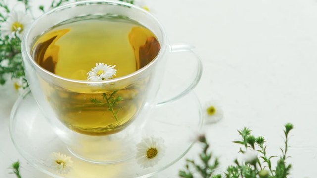 Glass cup of herbal tea