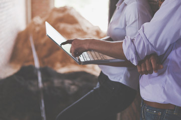 Consultant engineer discussing construction project in blueprint; Consulting concept in construction at office indoor