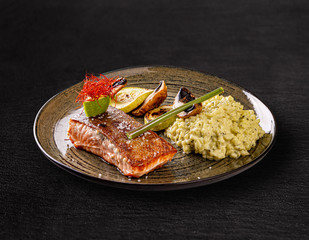 Grilled salmon served with vegetables