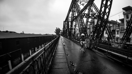 long bien bridge in hanoi with single biker - 291675647