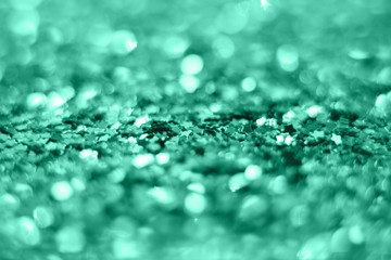 Mint Christmas background from sparkles of stars. blurred