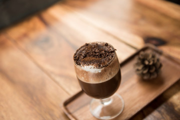 selective focus close up home made hot chocolate .Wood table top with chocolate in cafe  or (coffee shop,restaurant ) Selective focus background