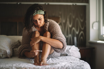 Sad woman after pregnancy test result