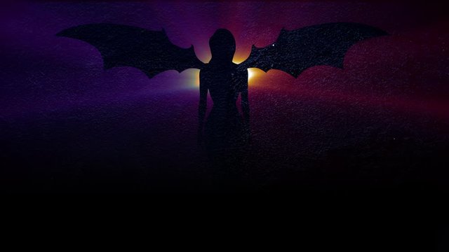Silhouette of a girl with wings, magic rays.