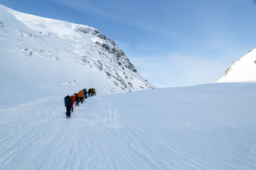 skiers in the mountains