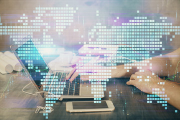 Multi exposure of businessman working on laptop on background. International business hologram in front. Concept of success.