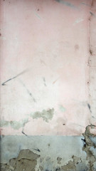  damaged exterior pink wall with grey lower part