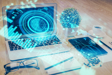 Double exposure of business theme icons and work space with computer background. Concept of success.