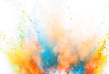 Colored powder explosion on white background. Freeze motion.