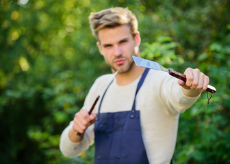 Perfect day for barbecue. man barbecue grill. Family weekend outing. Summer picnic. Tools for roasting meat outdoors. picnic cooking utensils. Outdoor party weekend. Culinary. Chef cooking bbq food