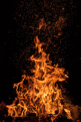Texture of fire wall isolated on a black background.