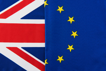 Very close up of European Union and British flags