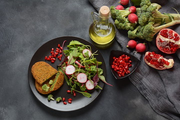 Broccoli schnitzel served with pomegranate salad. Healthy vegan food . Low -fat diet