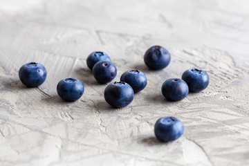 Blueberries on textured background with shallow focus