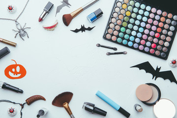 Photo of shadows, brushes, halloween spider, ghost on empty white background.