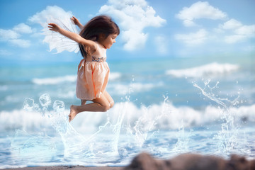 Charming fairy girl with wings jumping on water
