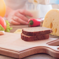sandwich with cheese on a wooden board