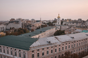 View overlooking the town. Kiev view into the distance to the city. Houses and buildings. Roofs of buildings. Cathedral in the city center. Streets, roof, houses, structures, a trip to Europe