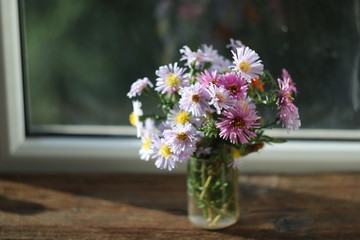 a bouquet of autumn colored flowers.