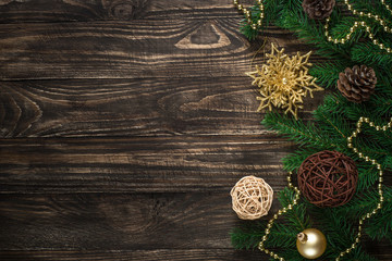 Christmas background with candle and decorations on dark wooden table.