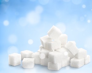 Cubes of sugar on white background