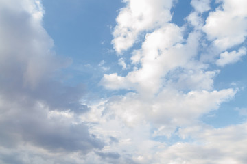 White fluffy clouds in the blue sky in summer