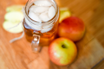 Apple juice freshly made in home kitchen with healthy chopped apples on the table