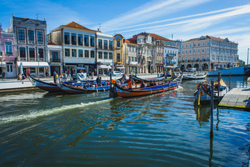 Fototapeta na wymiar Gondolas for tourists on the channel of a portuguese city