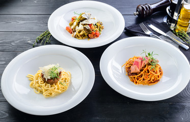 set of three italian pasta on the table