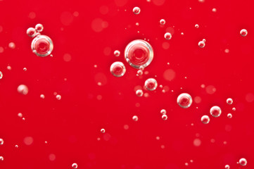 Bubbles of oxygen in a red liquid. Blood. For conceptual medical projects or helloween. Macro