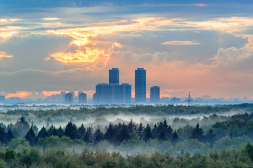 Sunset and fog after rain over Moscow