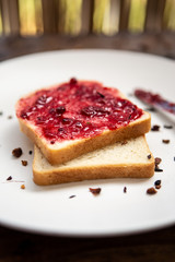 breakfast with bread and wild berries jam