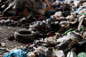 Garbage pile in trash dump or landfill, Waste from household in waste landfill, waste disposal in dumping site, excavator machine is working on a mountain garbage.