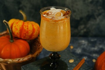 Pumpkin spice latte Smoothie / Pumpkin Spice Latte Smoothie / Fall autumn drink on rustic dark background, selective focus